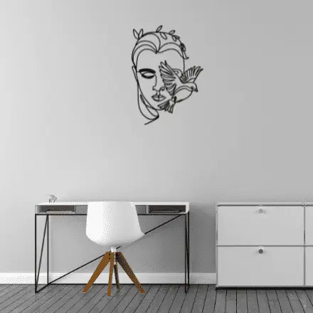 women, birA minimalistic metal line decor of a face and bird. Abstract art , stylish and thoughtful.