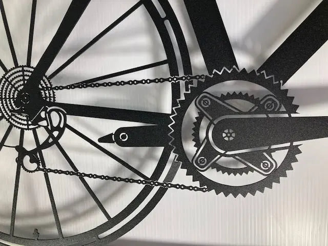 Metal bike wall art in a frame showing amazing detail of the chain and gears